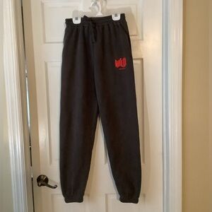Dark gray with red puffy writing sweatpants from white fox in XS euc